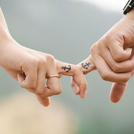 Husband and wife hot sale ring finger tattoos